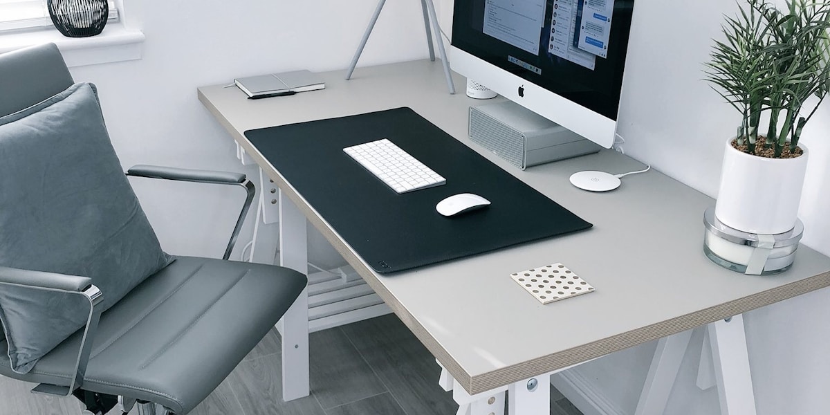 Home office desk with chair and laptop
